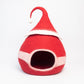 Red gnome-style pet house with a white trim on a light gray background