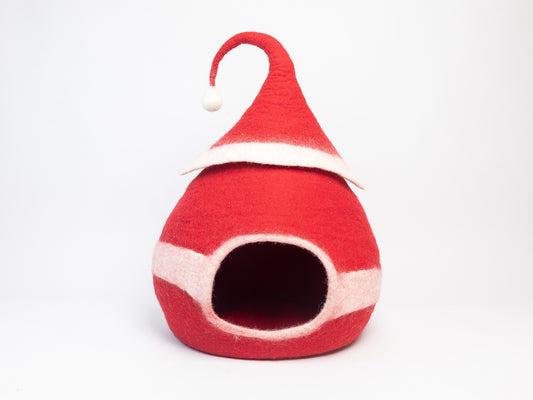 Red gnome-style pet house with a white trim on a light gray background