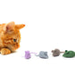 Orange cat playing with colorful catnip mice on a white background