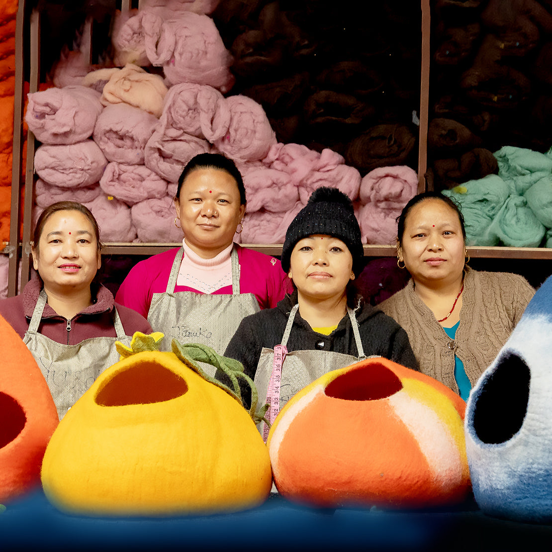 Women artisans in Nepal crafting handmade wool dog beds